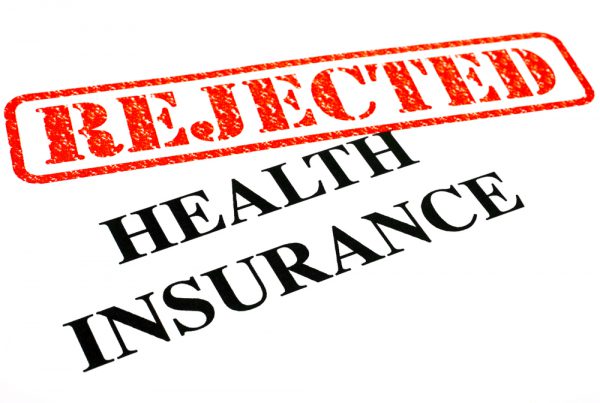 A close-up of a REJECTED Health Insurance document.